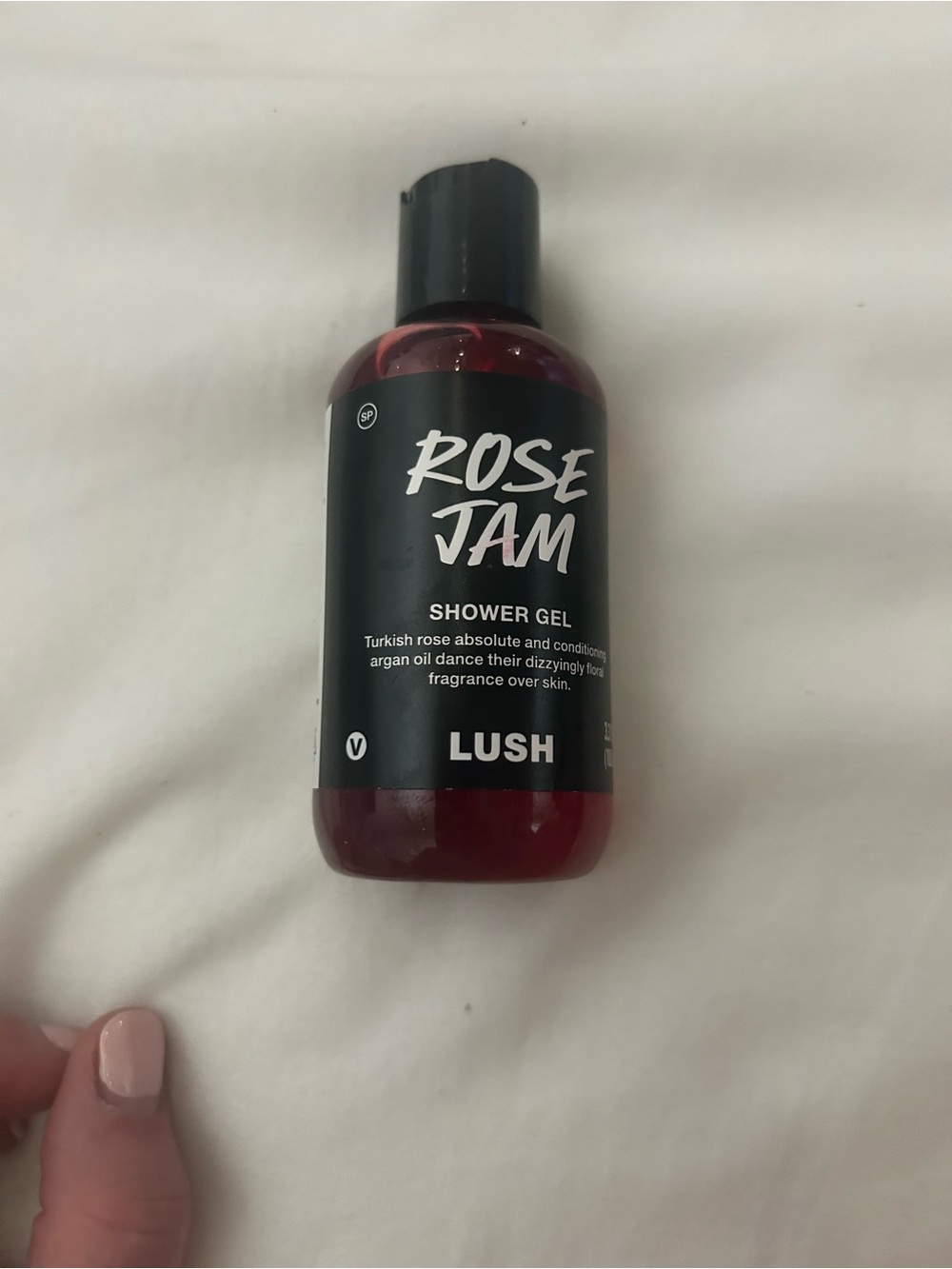 LUSH Rose Jam Shower Gel in deep red bottle